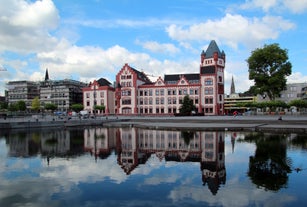 Photo of scenic summer view of the German traditional medieval half-timbered Old Town architecture and bridge over Pegnitz river in Nuremberg, Germany.