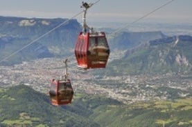 Photo of morning cityscape view with mountains, river and bridge in Grenoble city on the south-east of France.