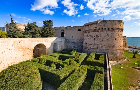 photo of Taranto Aragonese castle tower on the sea, Puglia, Italy.