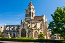 Photo of Vannes, beautiful city in Brittany, boats in the harbor, with typical houses and the cathedral in background, France.