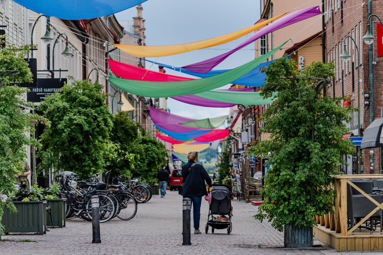 A mother moving her baby's cart in Östersund, Sweden.