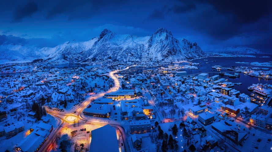 Panoramic winter view of Svolvaer in the night, Lofoten Islands, Norway. Blue hour winter view.