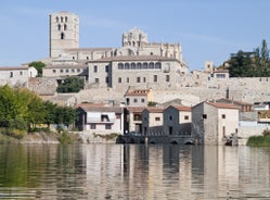 Photo of San Salvador Cathedral of Zamora and acenas (water mills), view from Duero river. Castilla y Leon, Spain.