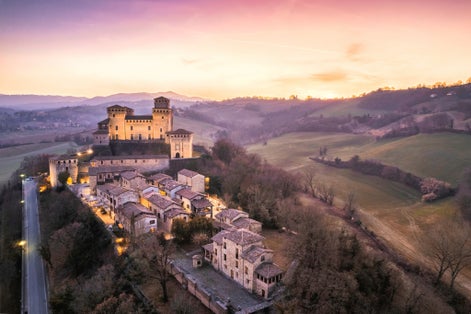 Panoramic aerial view of Torrechiara Castle during winter sunset. Parma, Italy.