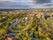 photo of aerial view of Groningen city Skyline from main park Stadspark area with festival builing up on racetrack event grounds, Netherlands.