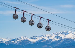 Photo of The winter view on the montains and ski lift station in French Alps near Chamonix Mont-Blanc.