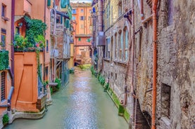 Famous buildings, gondolas and monuments by the Rialto Bridge of Venice on the Grand Canal, Italy.