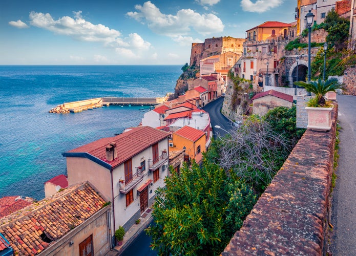 photo of  view of Amazing morning view of Scilla town with Ruffo castle on background, administratively part of the Metropolitan City of Reggio Calabria, Italy. Attractive summer seascape of Mediterranean sea.