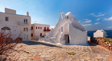 Photo of panoramic aerial view of the popular Platis Gialos beach on the Greek island of Mykonos with turquoise sea, Greece.