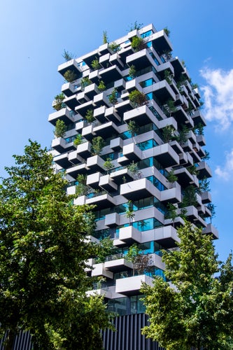 Eindhoven, The Netherlands, June 29th, 2021. Vertical garden tower with trees creating greenery and nature for the social housing residents of the city, Strijp S.