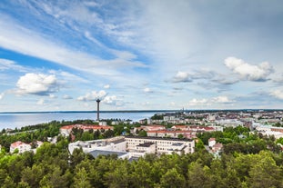 Early autumn morning panorama of the Port of Turku, Finland, with Turku Castle at background.