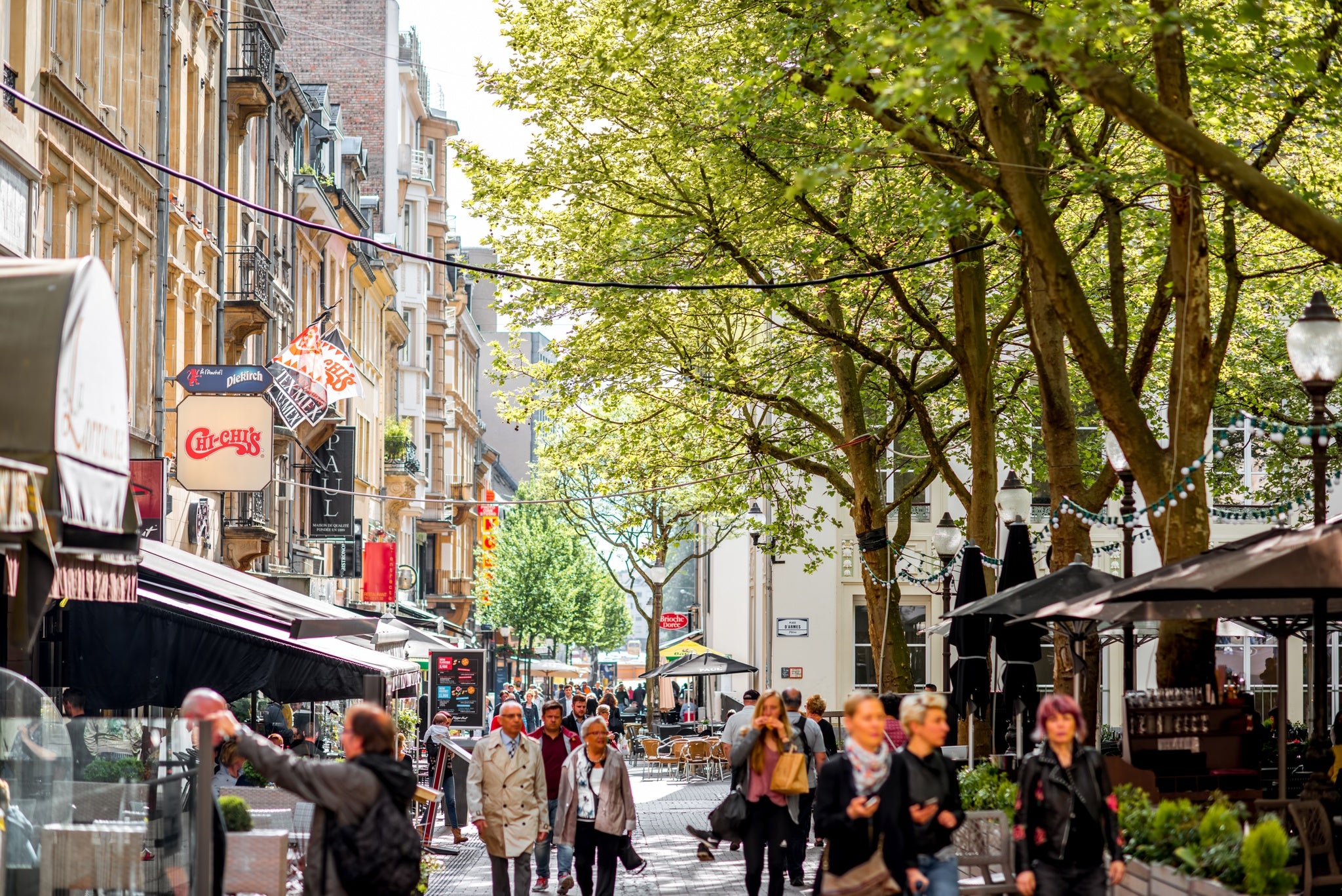 crowded Armes square with shops and restaurants in Luxembourg city.jpg