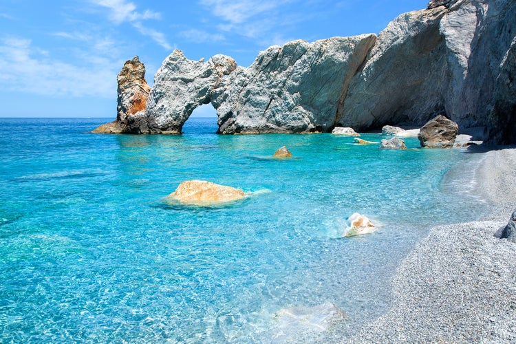 Photo of the famous rock with a hole in Lalaria Beach, Skiathos.