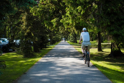 Photo of cyclist riding in Pärnu Rannapark (Pärnu Beach Park). Popular walking and recreation area in Pärnu.