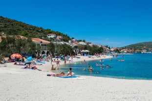 photo of a beautiful panoramic view of Kastel Luksic harbor and landmarks summer view, Split region of Dalmatia, Croatia.