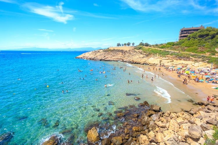 Beautiful sea lagoon with beach and tourists, Salou, Spain.