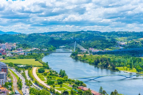 Valley of river Mondego and Ponte Rainha Santa Isabel bridge at Coimbra, Portugal