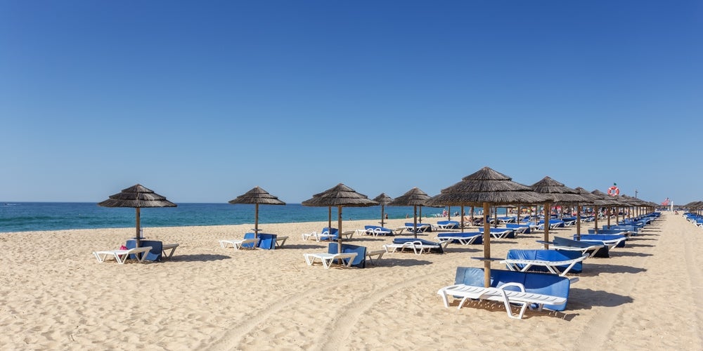 Photo of amazing beach on island of Tavira. Algarve Portugal.