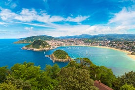 Photo of aerial view of Vizcaya bridge over the river and cityscape at Portugalete, Spain.