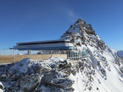 Photo of The mountain village at the Austrian ski resort Soelden on a cold and sunny winter day.