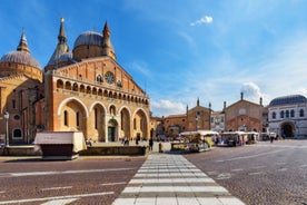 Photo of beautiful view of canal with statues on square Prato della Valle and Basilica Santa Giustina in Padova (Padua), Veneto, Italy.