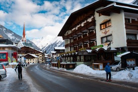 Photo of The mountain village at the Austrian ski resort Soelden on a cold and sunny winter day.