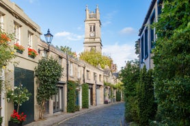 Photo of traditional architecture with shops and restaurants along a pedestrian street in Dunfermline town centre at sunset, Fife, Scotland, UK.