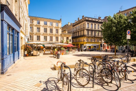 View on the small square with bicycles in Bordeaux city in France