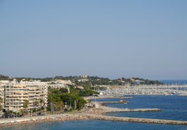 Photo of beautiful aerial view of Saint-Tropez, France with seascape and blue sky.