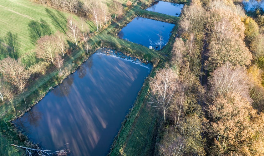 photo of view of Aerial view of a trout farm with three fish farms, near Wolfsburg, Germany, aerial view with drone