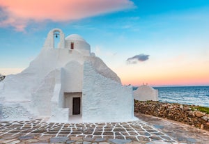 Photo of beautifull view over Mykonos from the sky with drone at the whitewashed village Greece.