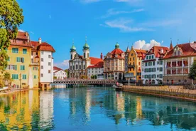 Panoramic view of historic Zurich city center with famous Fraumunster, Grossmunster and St. Peter and river Limmat at Lake Zurich on a sunny day with clouds in summer, Canton of Zurich, Switzerland