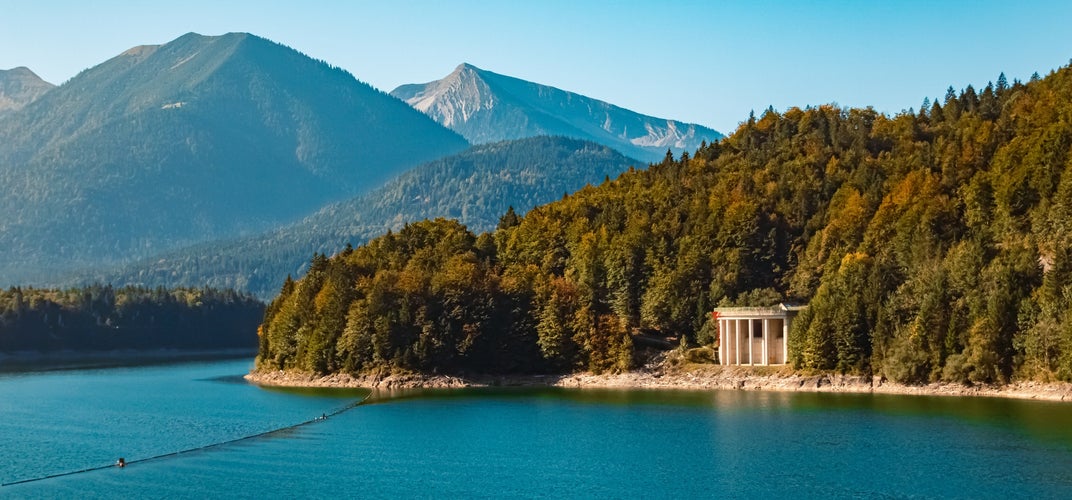 Alpine autumn or indian summer landscape shot at reservoir Lake Sylvenstein, Lenggries, Bad Toelz-Wolfratshausen, Bavaria, Germany