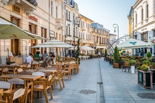 Antique building view in Old Town Bucharest city - capital of Romania and Dambrovita river. Bucharest, Romania, Europe.