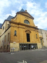 Photo of Metz city view of Petit Saulcy an Temple Neuf and Moselle River in Summer, France.