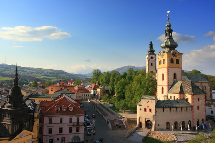 Photo of aerial view of main square in Banska Bystrica, Slovakia from above during summer day with historical fortification.