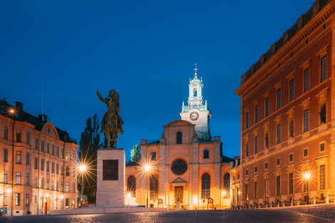 photo of Stockholm, Sweden. Statue of former Swedish King Karl XIV Johan Sitting on a horse near the great church Storkyrkan. Famous Popular Destination Scenic Place in night light.