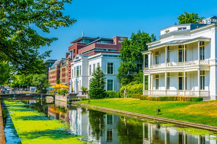 White mansion alongside a channel in the Hague, Netherlands