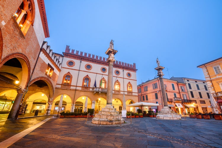 photo of view of Ravenna, Italy at Piazza del Popolo with the landmark Venetian columns at dusk.