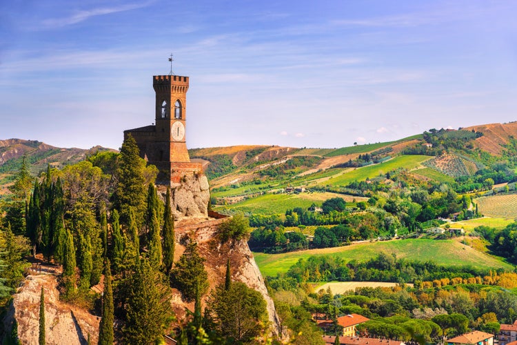 photo of view of Brisighella historic clock tower on the cliff. This 1800s architecture is known as the Torre dell'Orologio. Ravenna province, .Emilia Romagna region, Italy, Europe.