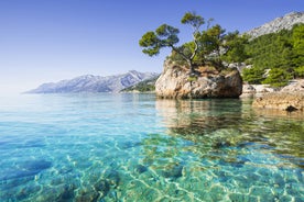 Photo of aerial view on Adriatic Sea and Baska Voda place in Makarska Riviera, Dalmatia region, popular tourist summer resort in Croatia.