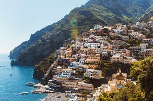 photo of Positano Amalfi Coast Italy Landscape Sunny and happiness view sea water blue and sky Italian village Ravello Nocelle Cinque terre pizza.