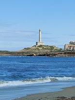 Photo of Beach seashore with wooden path to sea water in San Pedro del Pinatar