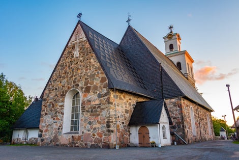 Sunset of Church of the Holy Cross in Finnish town Rauma.