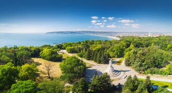 Photo of aerial view of The Cathedral of the Assumption and Varna city at amazing sunset, Bulgaria.