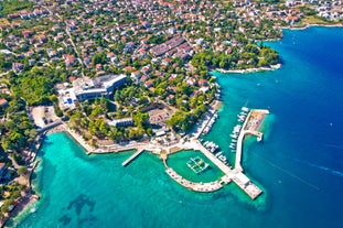 Photo of aerial view of Historic Adriatic town of Krk aerial view, Island of Krk, Kvarner bay of Croatia.