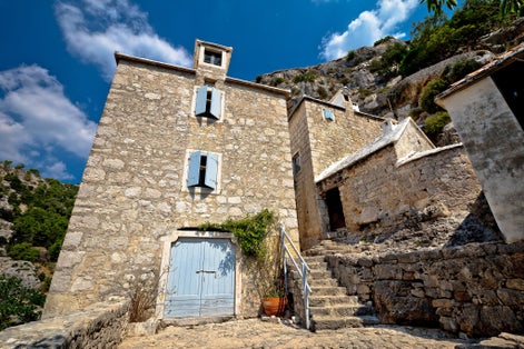 Photo of Pustinja Blaca hermitage on the rock, island of Brac, Dalmatia, Croatia.