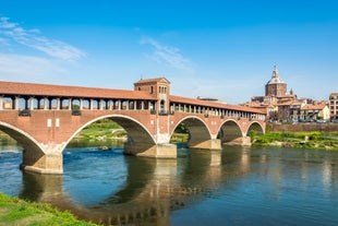 Photo of aerial view of Pavia and the Ticino, Cathedral of Pavia and Covered Bridge, Italy.