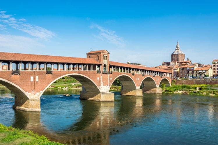 Ponte coperto ( covered bridge ) or Ponte Vecchio over Ticino river in Pavia, Lombardy, Italy