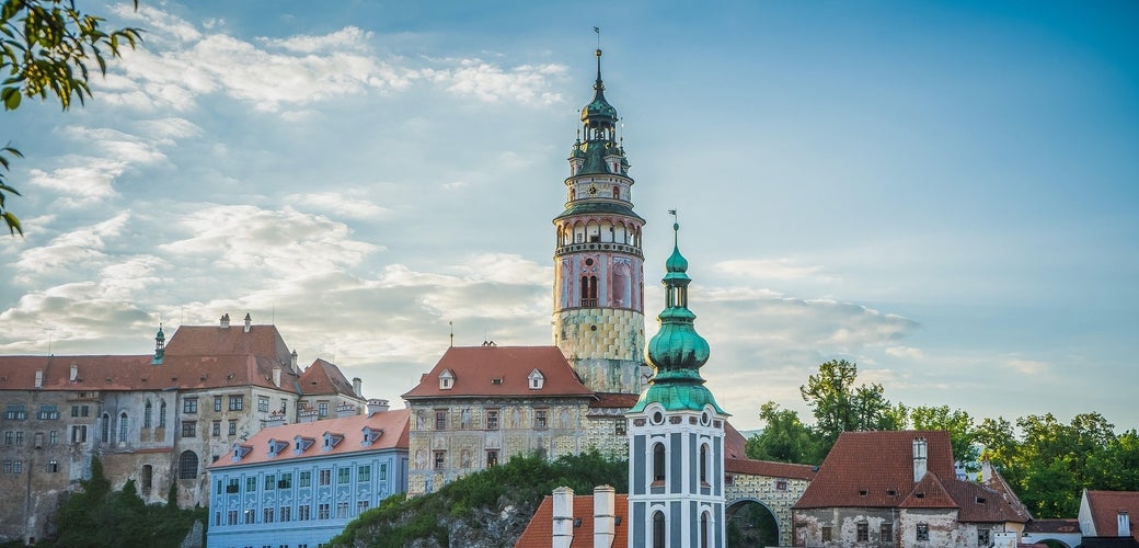 Cesky Krumlov Castle and colorful rooftops under a clear summer sky in Czechia in July..jpg